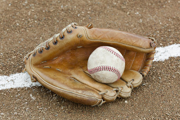 A baseball and baseball glove