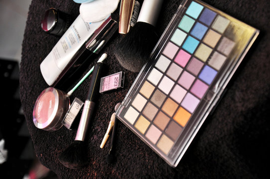 Few kinds of make-up on black towel