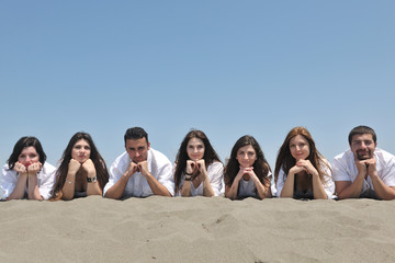 Group of happy young people in have fun at beach