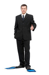 man in a business suit and flippers for swimming