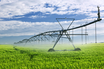 Irrigation equipment on farm field - 32908063