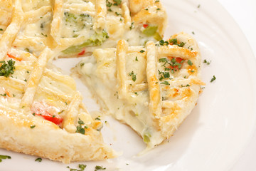 tasty quiche with cheese and herbs