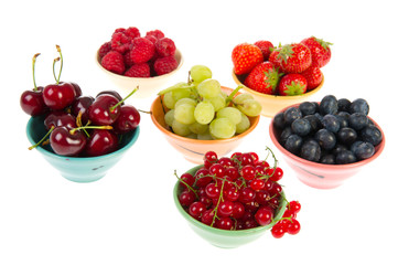 Colorful bowls fresh summer fruit
