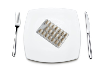 pack of pills on plate