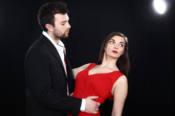 young couple in spot light