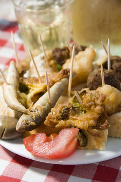 plate of mezes appetizers wine Greek food