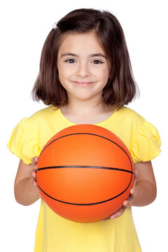 Brunette little girl with a basketball