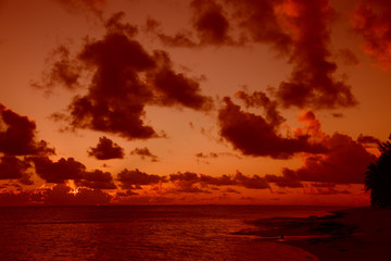 Cloudscape over Ocean and Island at Sunset
