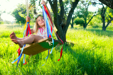 Young girl on swing