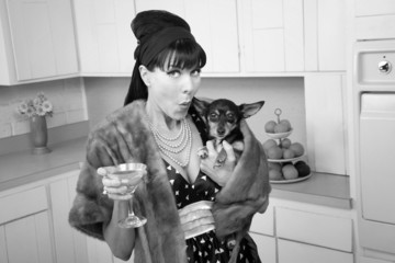 Woman Holds a Chihuahua