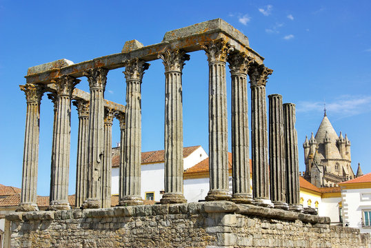 Roman temple and cathedral tower of Evora, Portugal.