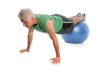 Obraz premium Mature Man Using Fitness Ball