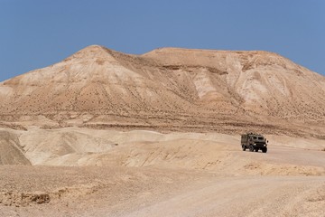 Israeli army Humvee on patrol in the Judean desert