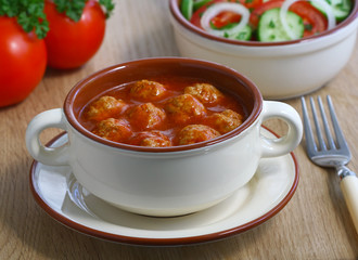Meatballs in tomato sauce.