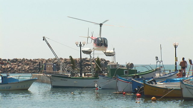 helicopter taking off in the port