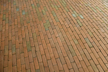 close up to the floor tiles which are thin and orange-colored