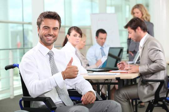 Disabled businessman smiling in office