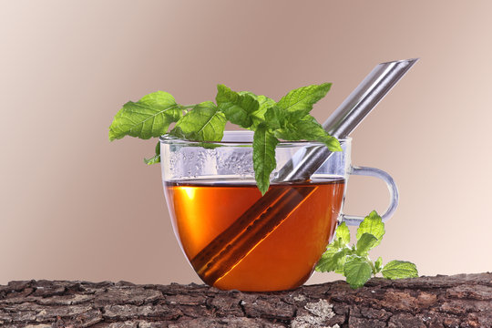 Tea with fresh herbs and tea strainer