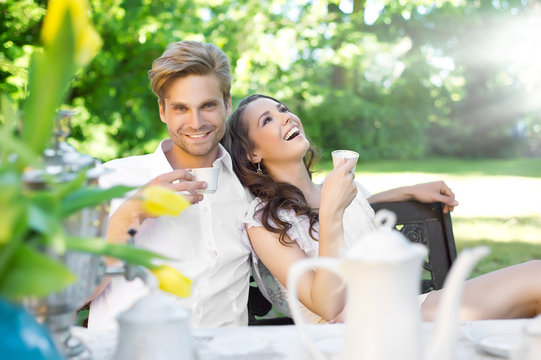 Young Couple Enjoying Lunch In The Garden