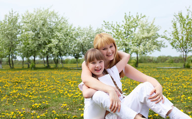 Obraz premium girl with mother in spring park