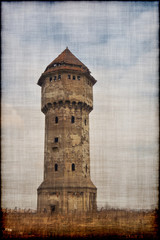 Old water tower. Artistic retro style on a canvas.