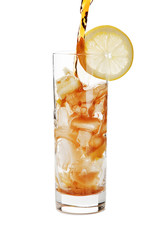 Pouring cola into a glass.