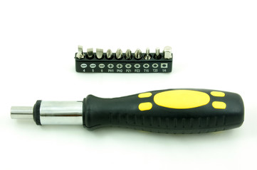 Screwdriver and set of heads isolated on white background