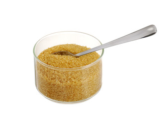 Golden demerara  sugar in glass bowl with teaspoon