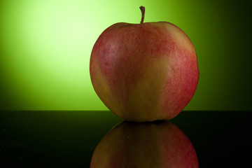 Apple on green background
