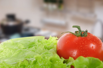 green salad and tomato isolated with blurred background