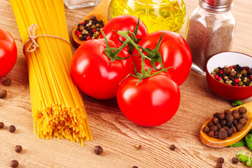 Pasta spaghetti with tomatoes, olive oil, peper  and basil on a