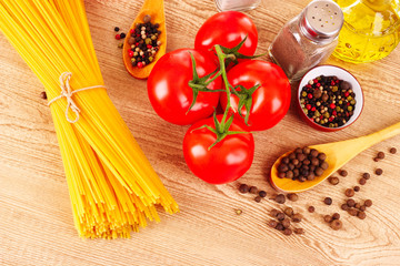 Pasta spaghetti with tomatoes, olive oil, peper  and basil on a