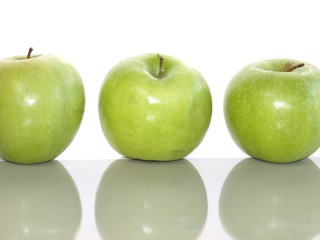 Fresh green apples on a white background