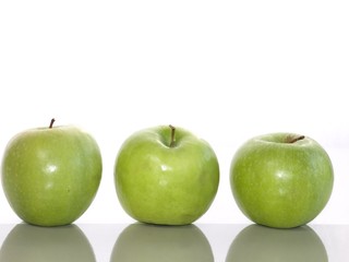 Fresh green apples on a white background