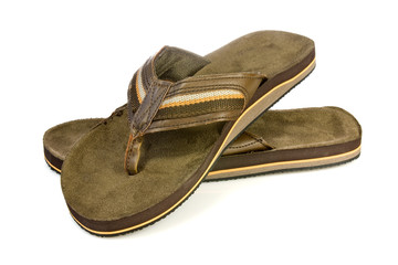 Pair of  men's flip flops over a white background.
