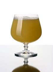 Glass goblet with a juice, isolated.