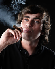 Closeup portrait of a man with cigar