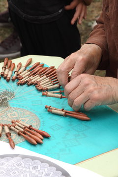 Process of lace-making with bobbins