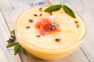 fresh melon soup with parma ham and lavender flower