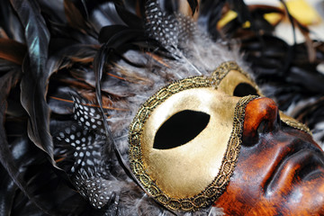 gold carnival mask with feathers