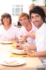 roommates eating pizza