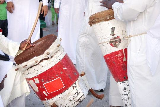Colorful traditonal drums played by artists with pearl song