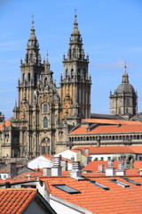 Fototapeta premium Cathedral of Santiago de Compostela over roofs with blue sky