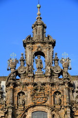 Top of Cathedral of Santiago de Compostela facade with blue sky
