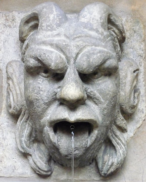 Gargoyle Spitting Water