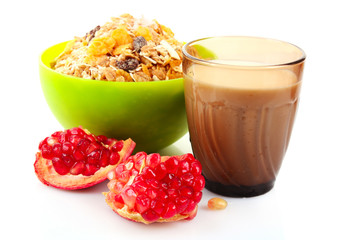 muesli, milk and pomegranate isolated on white