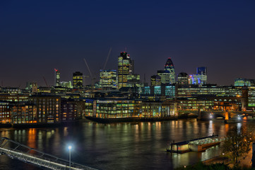 Fototapeta na wymiar City of London, England, UK, over River Thames, at nightfall