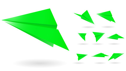 green paper planes isolated on white background