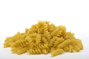 Raw spiral pasta noodles in a pile