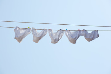 White underpants hanging to dry